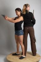 2021 01 OXANA AND XENIA STANDING POSE WITH GUNS (1)